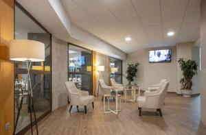 TV a/nebo společenská místnost v ubytování Rosamar & Spa 4*s