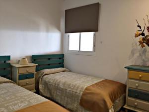 Ein Bett oder Betten in einem Zimmer der Unterkunft Casa Ananda y Casa Rengue