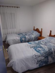 A bed or beds in a room at Apartamento Barcelo 4