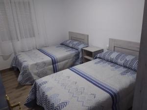 A bed or beds in a room at Apartamento Barcelo 4