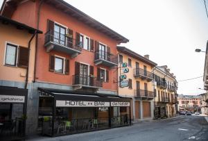 a building with a hotel on the side of a street at HOTEL - BAR DA NATALE in Paesana