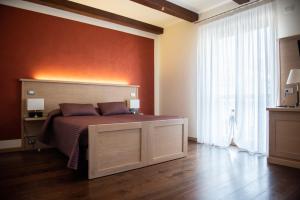 Postel nebo postele na pokoji v ubytování HOTEL - BAR DA NATALE + 25 fotografií
