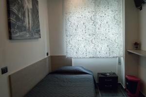 Postel nebo postele na pokoji v ubytování B&B Adriatico