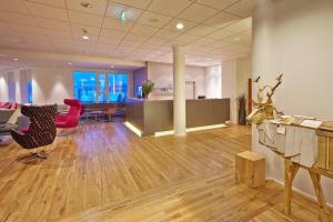 an office with a lobby with a table and chairs at Hérað - Berjaya Iceland Hotels in Egilsstaðir