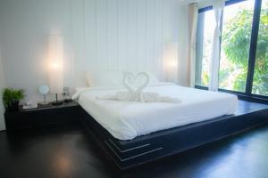 Postel nebo postele na pokoji v ubytování Trat 101 Hotel - SHA Certified