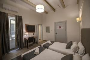Letto o letti in una camera di Europa Hotel