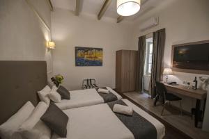 Letto o letti in una camera di Europa Hotel