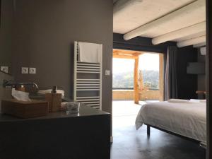 Postel nebo postele na pokoji v ubytování Les cabanons de Mémé Jeannette