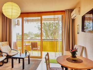a living room with a couch and a table at seeYOU apartment Balatonfüred in Balatonfüred