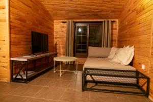 a room with a couch and a desk and a television at Hotel Casa De Padre in Kemer