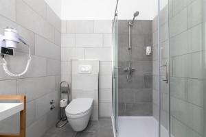 a bathroom with a shower and a toilet and a sink at Preziosa in Pula
