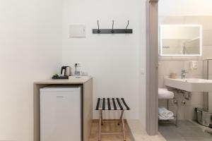 a small bathroom with a sink and a counter at Preziosa in Pula +37 photos