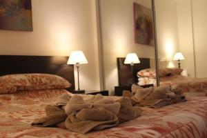 Cama o camas de una habitación en Marlenghi Apartments 8