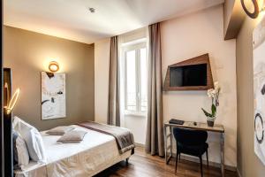 Μια τηλεόραση ή/και κέντρο ψυχαγωγίας στο Al Manthia Hotel - Gruppo Trevi Hotels