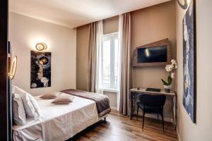 Кровать или кровати в номере Al Manthia Hotel - Gruppo Trevi Hotels