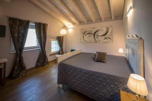 Postel nebo postele na pokoji v ubytování Agriturismo Casarai