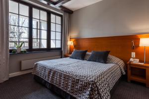 Postel nebo postele na pokoji v ubytování Hotel SPA Dr Irena Eris Wzgórza Dylewskie