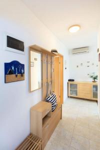 a room with a wooden cabinet and a counter at Put Maslina 7 in Savudrija +15 photos