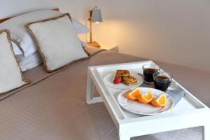 Postel nebo postele na pokoji v ubytování Ammos Luxury Rooms & Home