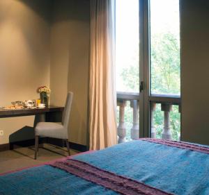 Letto o letti in una camera di Tufenkian Historic Yerevan Hotel