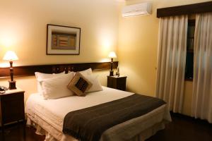 Cama ou camas em um quarto em Hotel Capim Limão Itaipava
