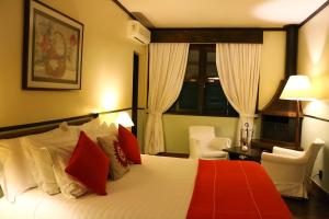 Cama ou camas em um quarto em Hotel Capim Limão Itaipava