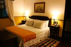 Cama ou camas em um quarto em Hotel Capim Limão Itaipava