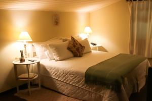 Cama ou camas em um quarto em Hotel Capim Limão Itaipava