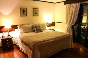 Cama ou camas em um quarto em Hotel Capim Limão Itaipava