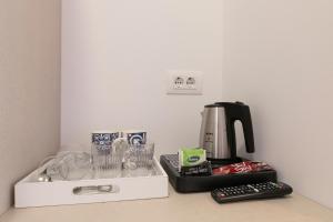 a coffee maker sitting on top of a counter at La Preziosa Rooms in Pula