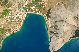 an aerial view of a beach and the ocean at Apartments Niko Metajna, island Pag in Metajna