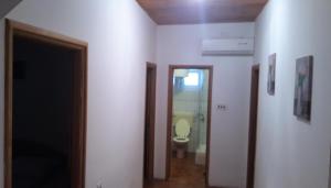 a hallway with a bathroom with a toilet in it at Apartments Niko Metajna, island Pag in Metajna