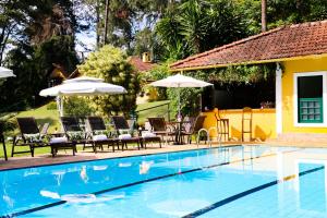 A piscina localizada em Hotel Capim Limão Itaipava ou nos arredores