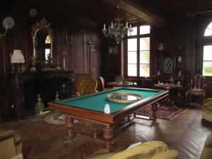 a living room with a pool table in it at Le domaine de Beaufai in Beaufai
