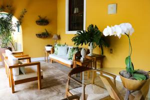 Uma área de estar em Hotel Capim Limão Itaipava