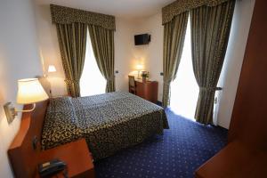 Postel nebo postele na pokoji v ubytování Hotel da Roberto + 37 fotografií