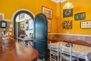 a kitchen with a table and a dining room at Alterhome Private Villa Cortijo Sierra y Lago in Arcos de la Frontera +68 photos