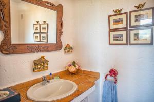 a bathroom with a sink and a mirror at Alterhome Private Villa Cortijo Sierra y Lago in Arcos de la Frontera