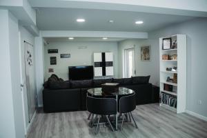 a living room with a couch and a table at WE ARE HOSTEL in Póvoa de Varzim
