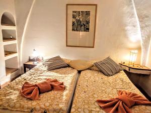 two beds in a small room with two at Finca Sa Tafona in Son Servera +42 photos