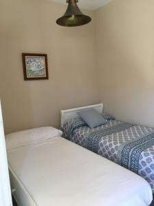 A bed or beds in a room at Ático Aretusa