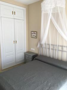 A bed or beds in a room at Ático Aretusa
