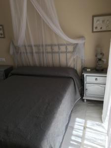 A bed or beds in a room at Ático Aretusa