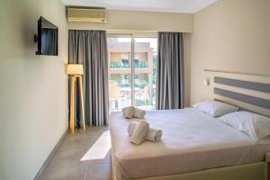 Postel nebo postele na pokoji v ubytování CNic Gemini Hotel