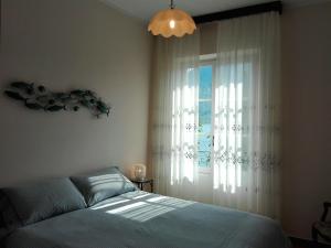 Ένα ή περισσότερα κρεβάτια σε δωμάτιο στο Residenza Il Gabbiano 1