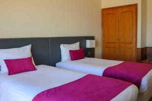 Кровать или кровати в номере Hotel Horta