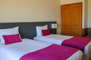 
Uma cama ou camas num quarto em Hotel Horta

