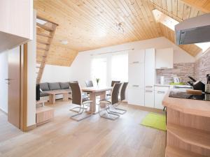 a kitchen and dining room with a table and chairs at House DorMica in Trenta