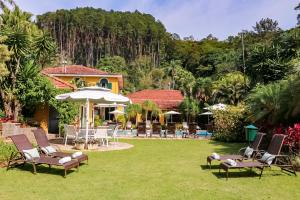 Um jardim em Hotel Capim Limão Itaipava