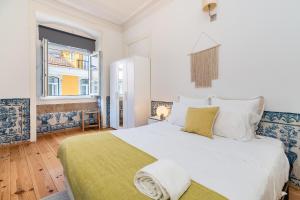 Кровать или кровати в номере Gonzalo's Guest Apartments - Downtown Historic Flats